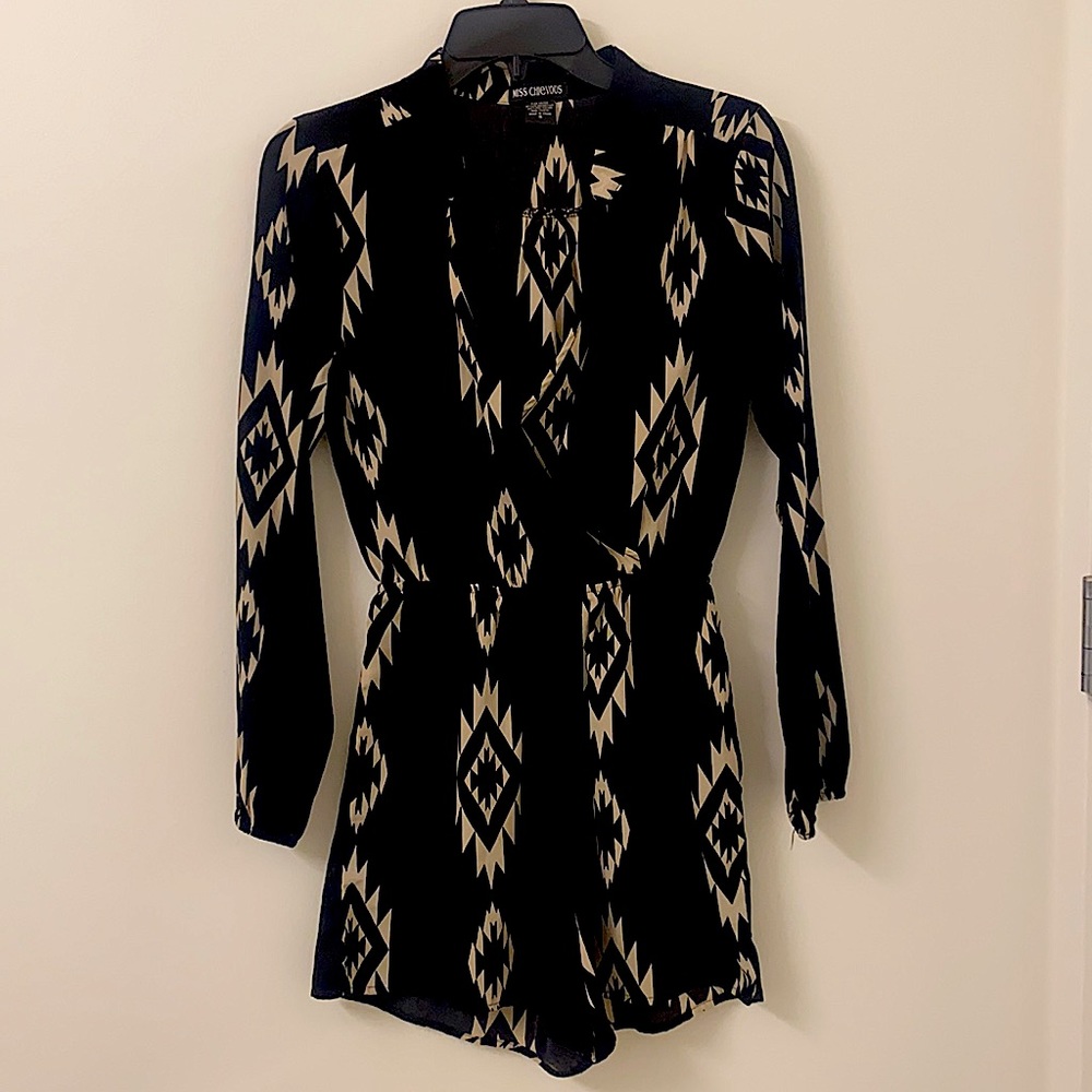 Tilley’s black tribal pattern romper